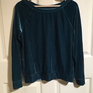 A teal, velvet sweater